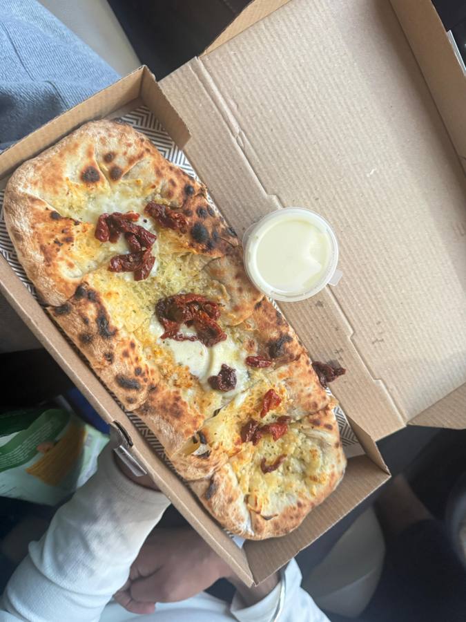 Sourdough flatbread with caramelised onions in a box